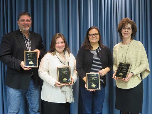 From left, Dr. Brian Schrader, Dr. Heather Caswell, Dr. Kelly O’Neal-Hixson and Dr. Elizabeth Dobler received recognition from their peers in The Teachers College.