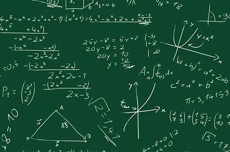 Math formulas written on chalkboard