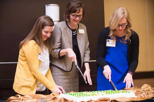 Janet Weaver, Associated Student Government president; from left, Allison Garrett, ESU president; and Elayna Coleman, ESU Ambassadors president, cut the birthday cake marking the university’s 153rd Founders’ Day.