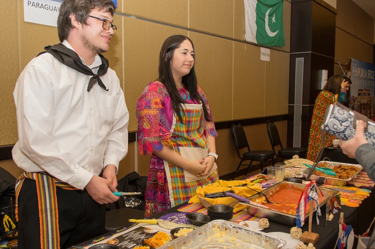 Students serving food at the Emporia State University International Food Festival