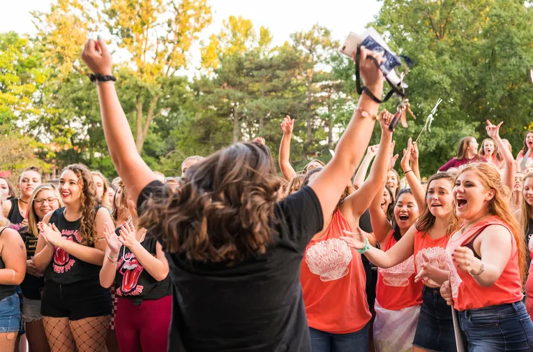 Students cheering during Bid Night