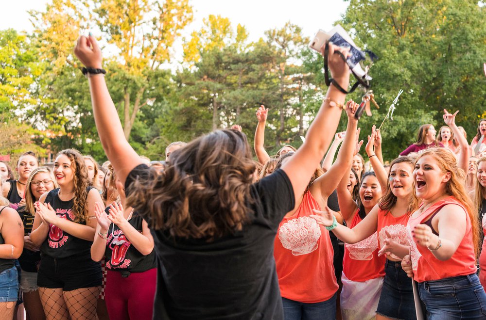 Students cheering during Bid Night