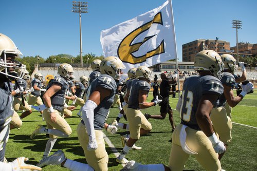 ESU Football team running onto the football field