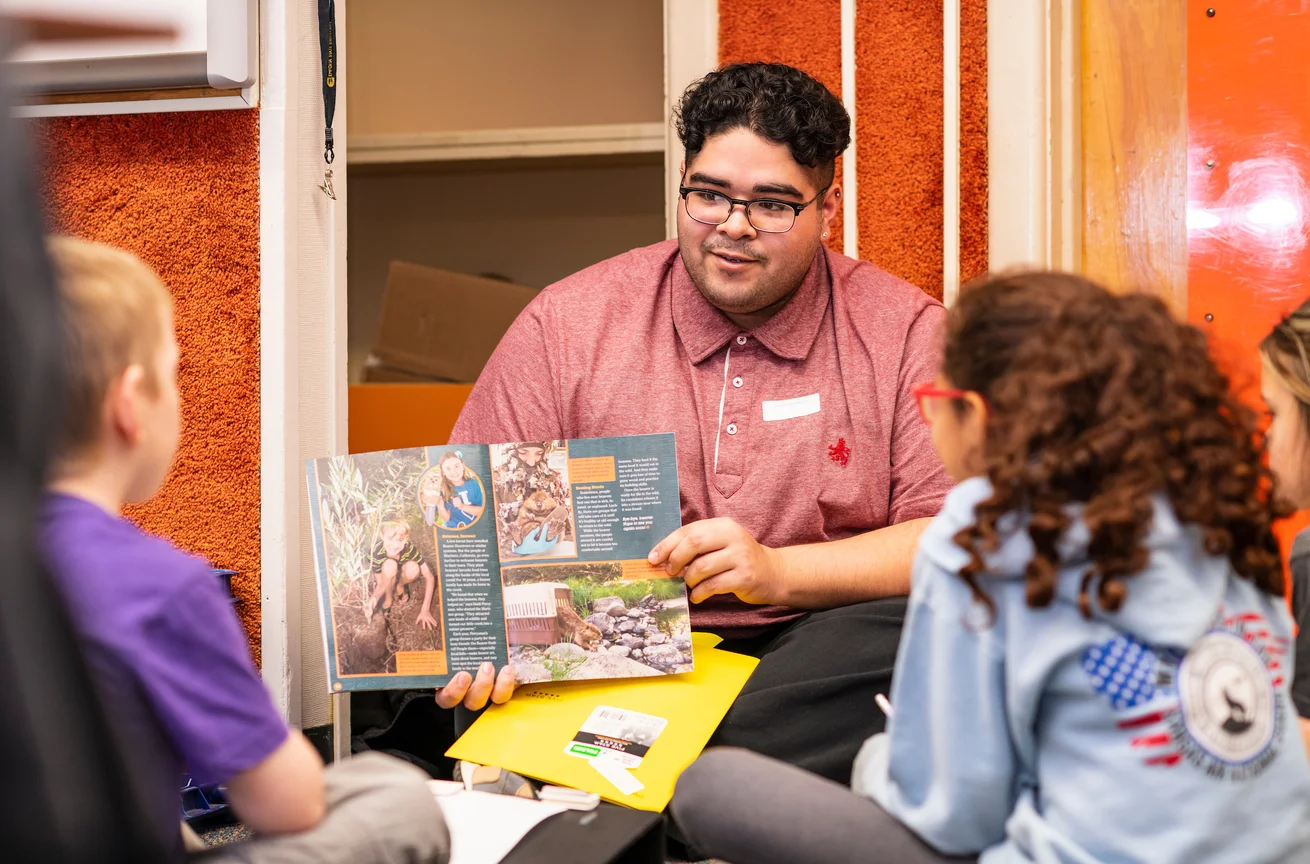 Emporia State Teachers College student reading to children