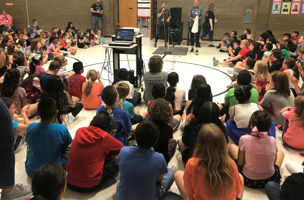 Students sitting in circle at elementary school