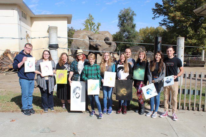 Emporia State Art Therapy Students posing with art at zoo