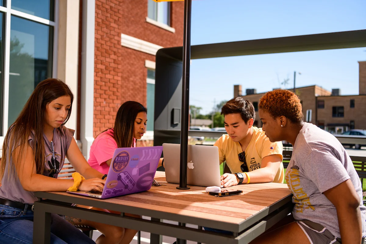 Students studying in front of Schallenkamp Residence Hall