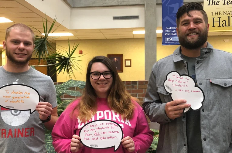 Secondary Education majors holding signs