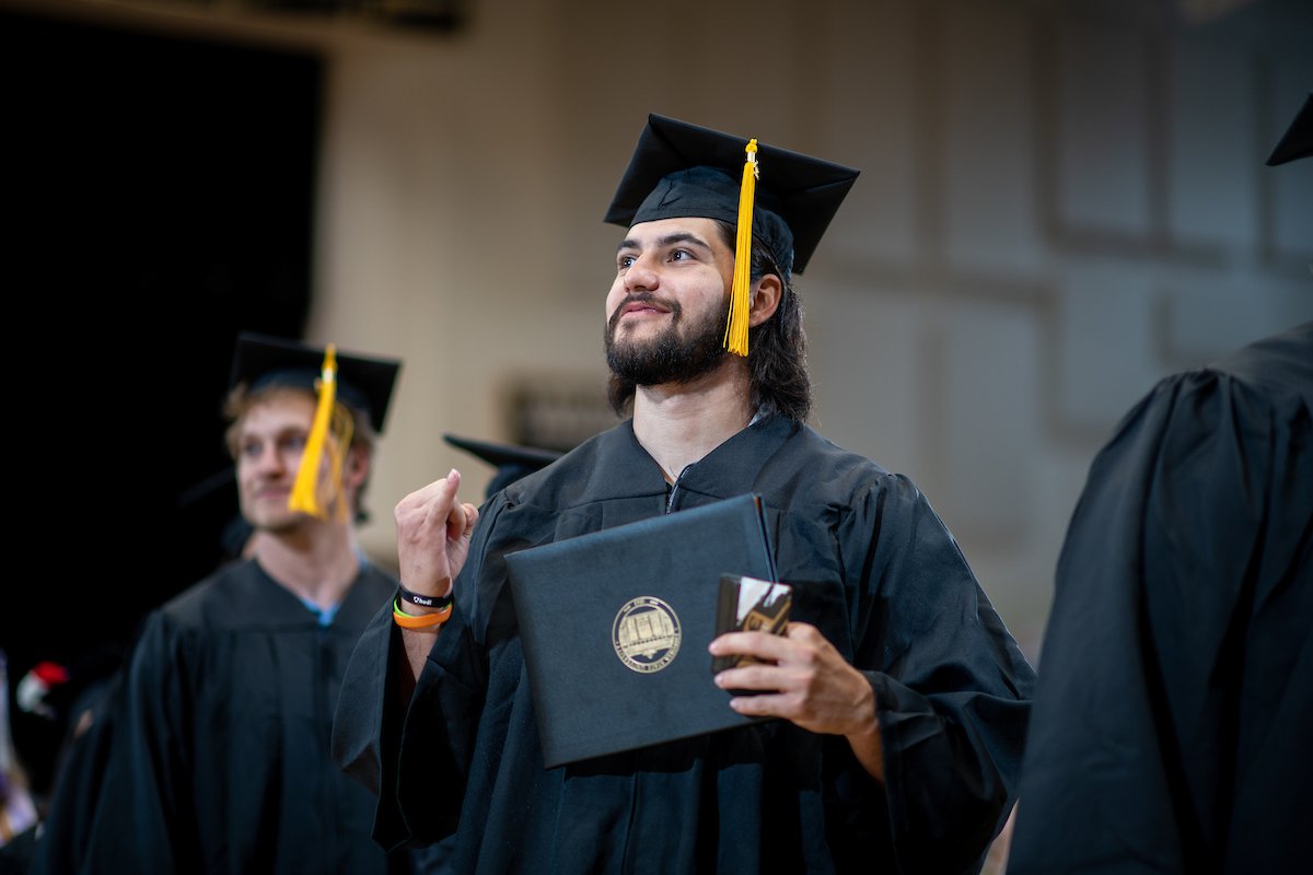 Student smiling at Commencement