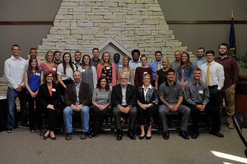 Emporia State student-athletes who received Earl W. Sauder Athletic Scholarships pose with the Sauder family before a luncheon celebration. 