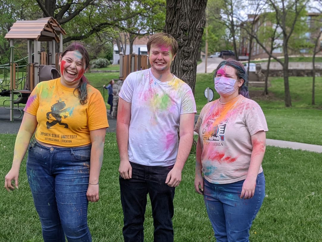 Three students participating in the color run