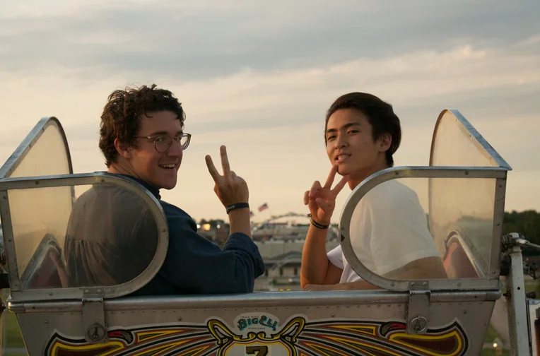 Two students riding ferris wheel