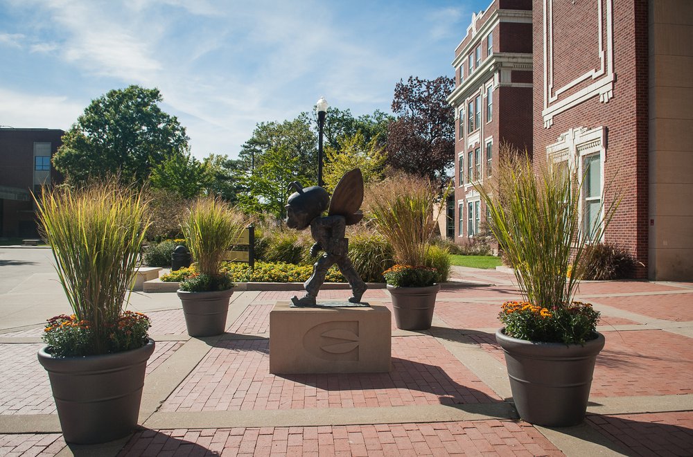 Bronze Statue of Emporia State's mascot, Corky in front of Plumb Hall