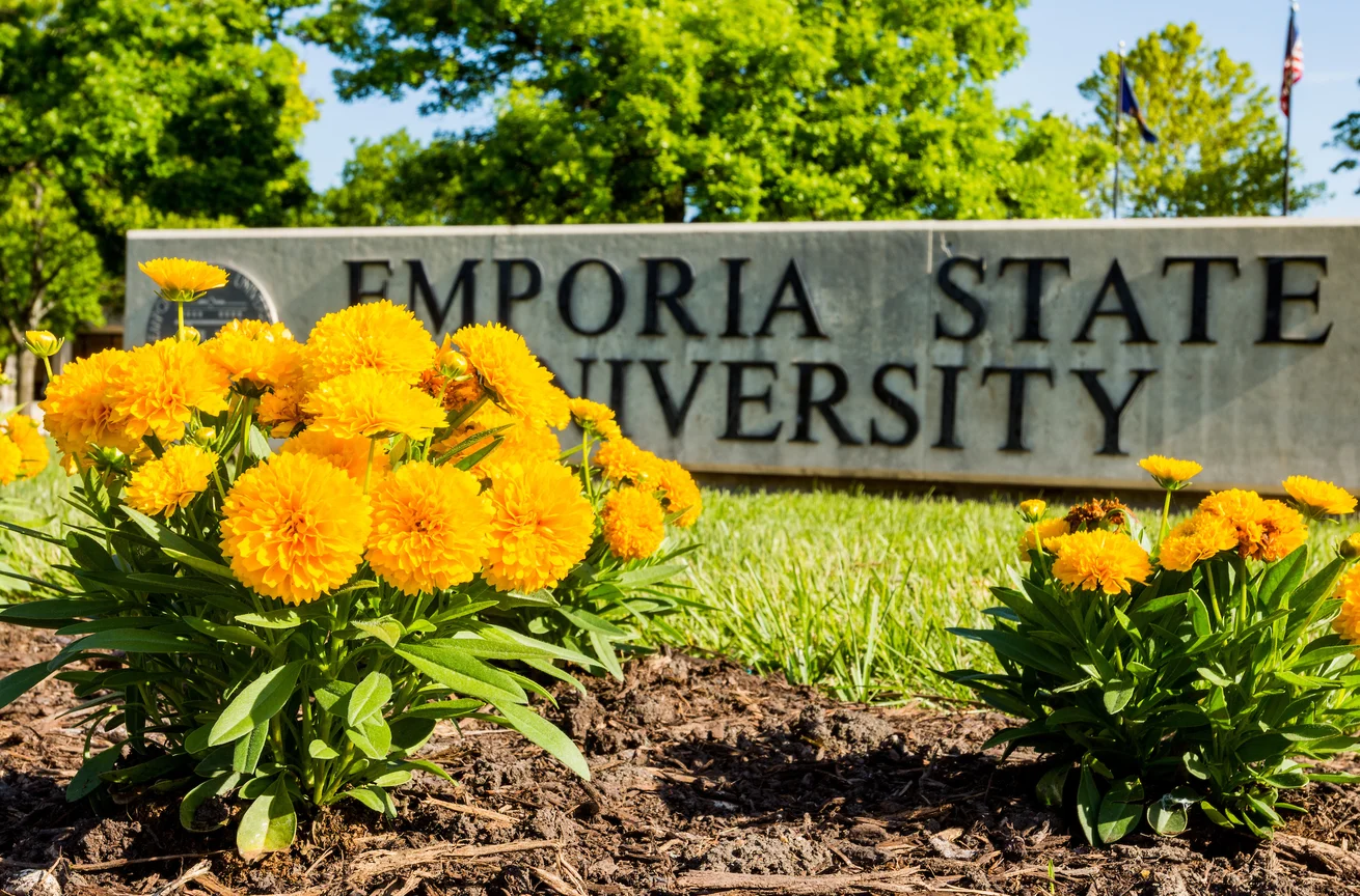 Emporia State University sign flanked by flowers