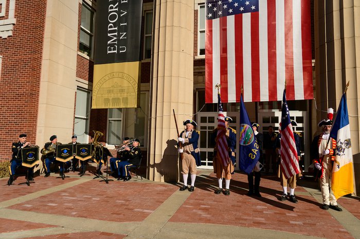 Flag celebration in front of Emporia State's Plumb Hall