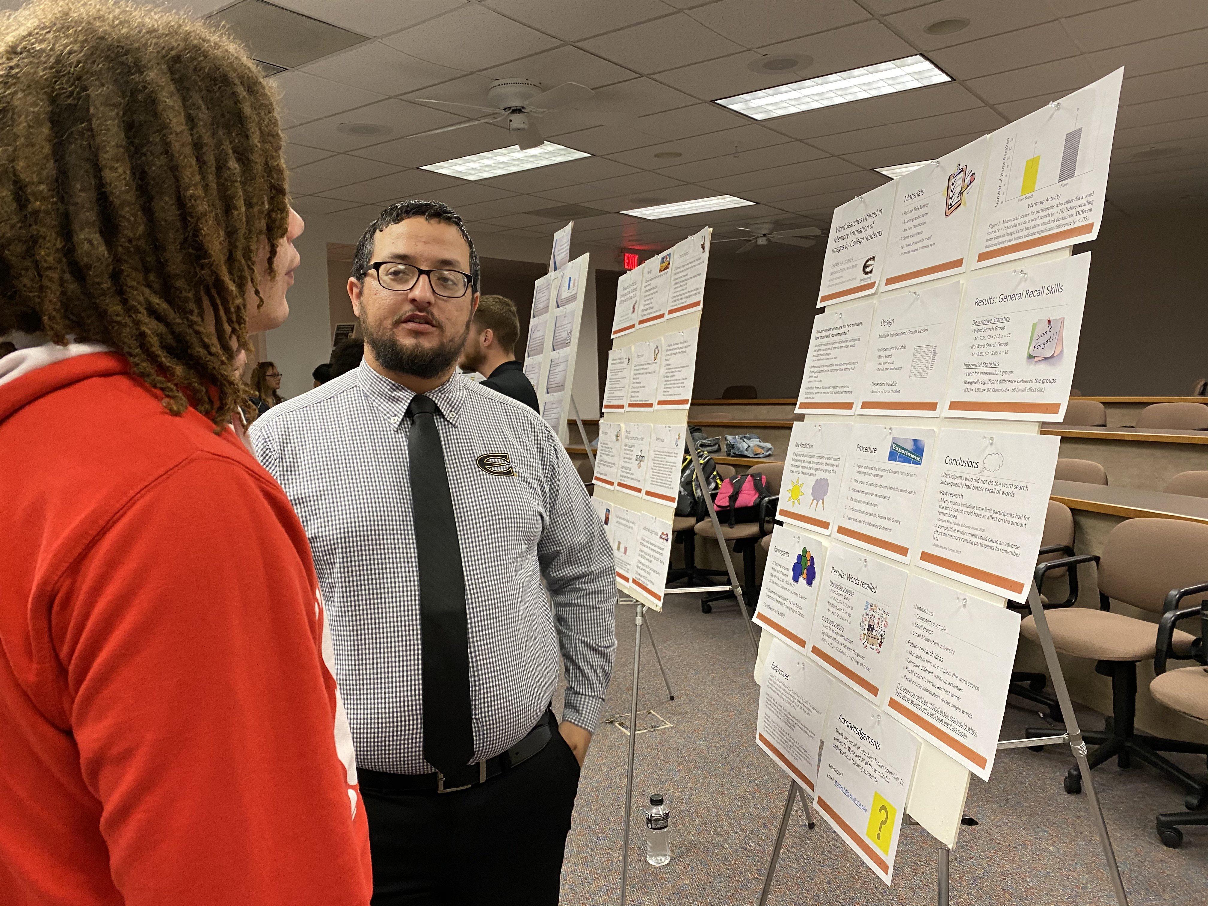 Emporia State Psychology students discussing poster presentation