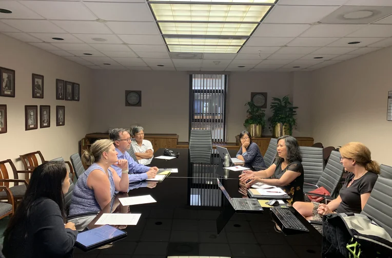 Faculty sitting in board room