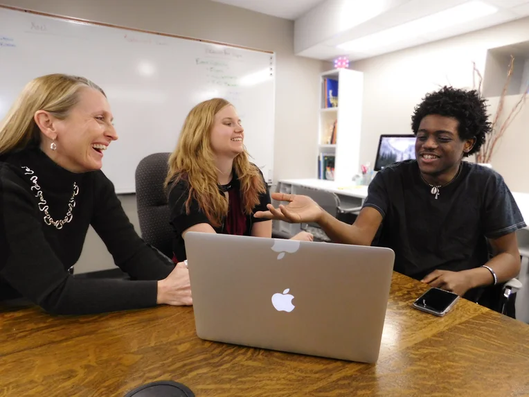 Undergraduate students visiting with English, Modern Languages and Journalism Professor Amy Sage Webb Baza