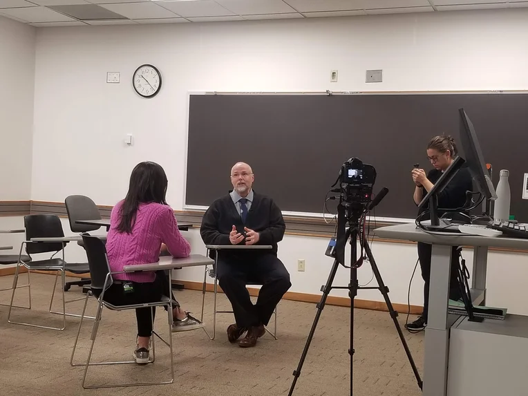 Professor being interviewed on ESU's campus