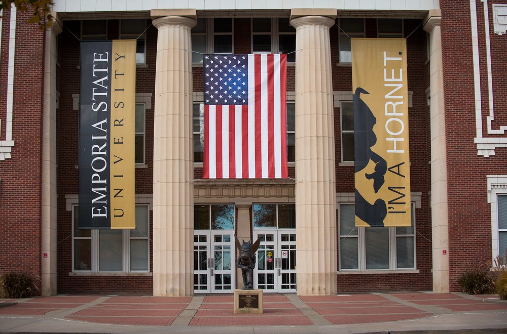 Flag in front of Emporia State's Plumb Hall
