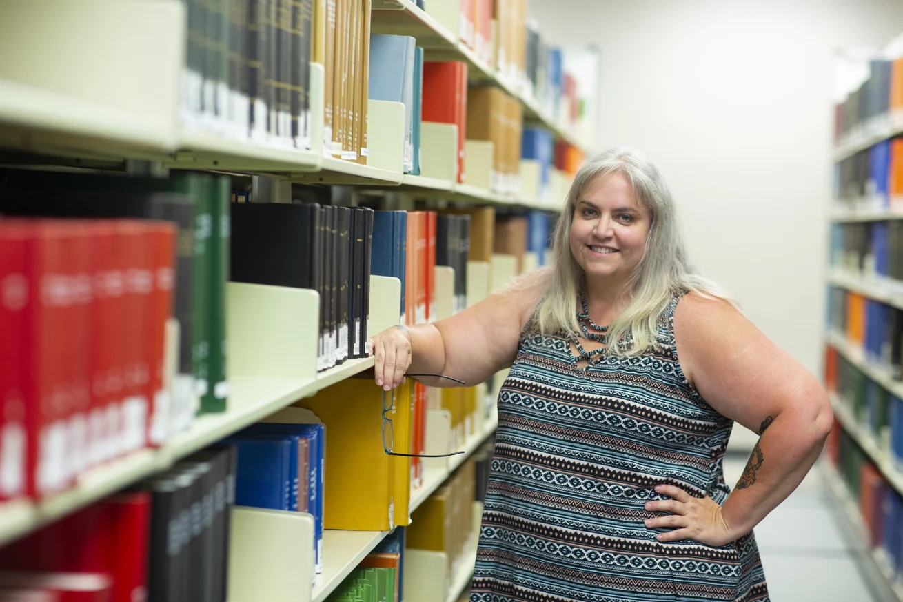 Social Sciences, Sociology and Criminology Faculty Rochelle Rowley posing in William Allen White Library