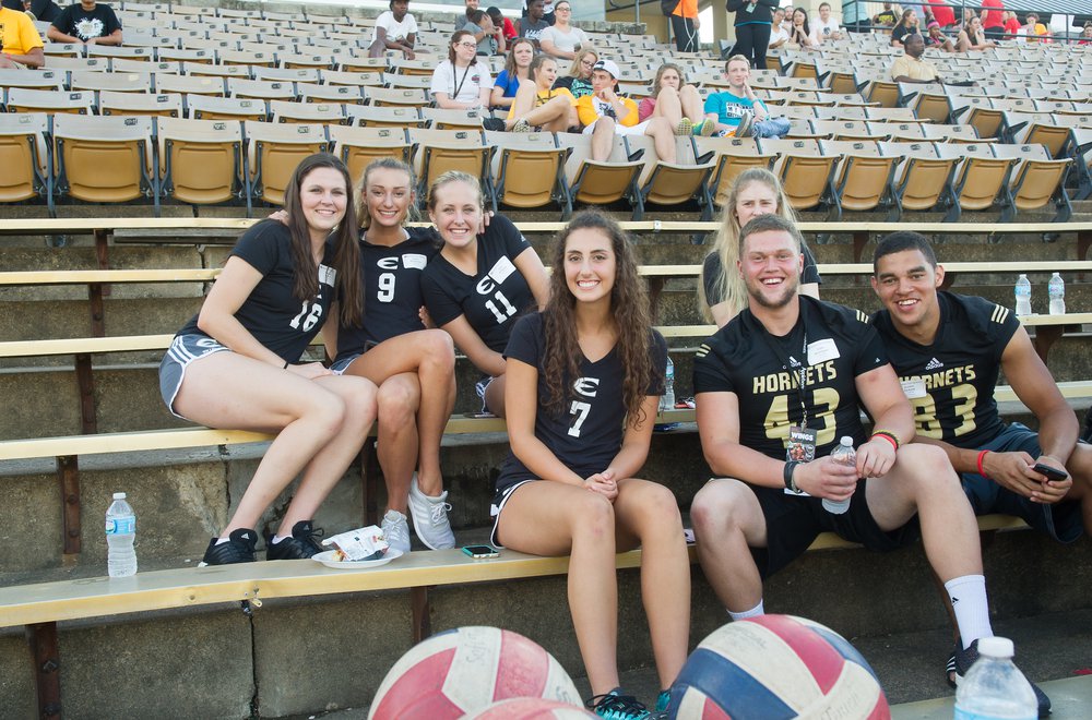 Emporia State student athletes sitting in bleachers