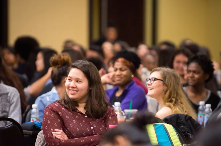 Group of Emporia State students listening to speaker