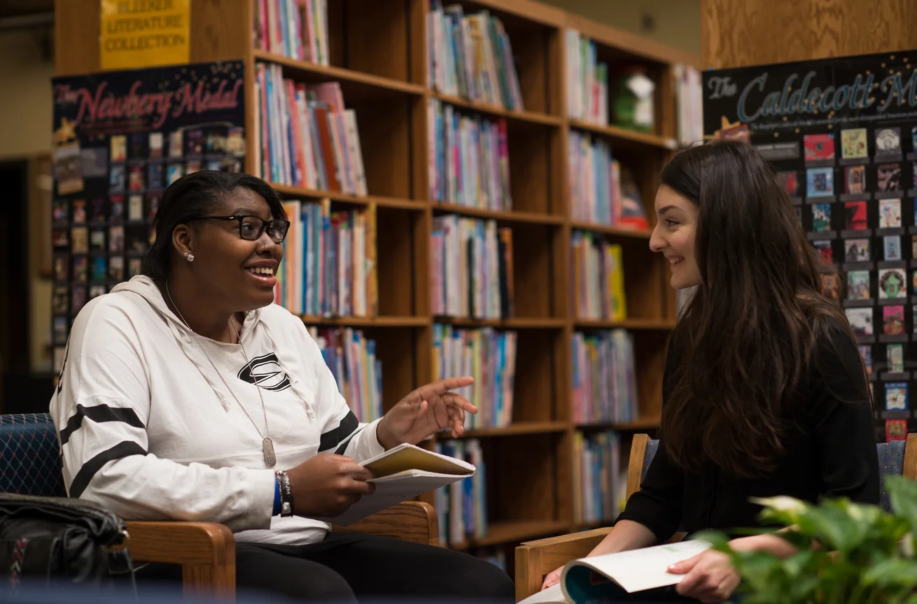 Students talking in Emporia State's William Allen White Library
