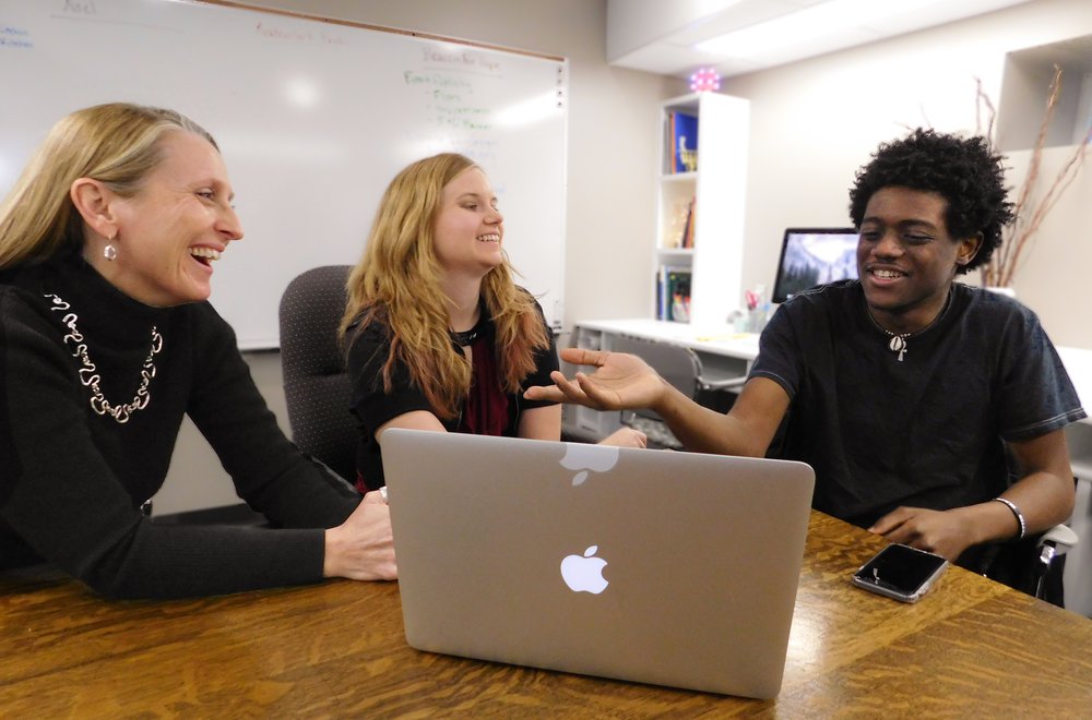 Students sitting with laptop.jpg