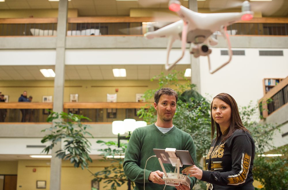 Students operating drone in Emporia State's Visser Hall