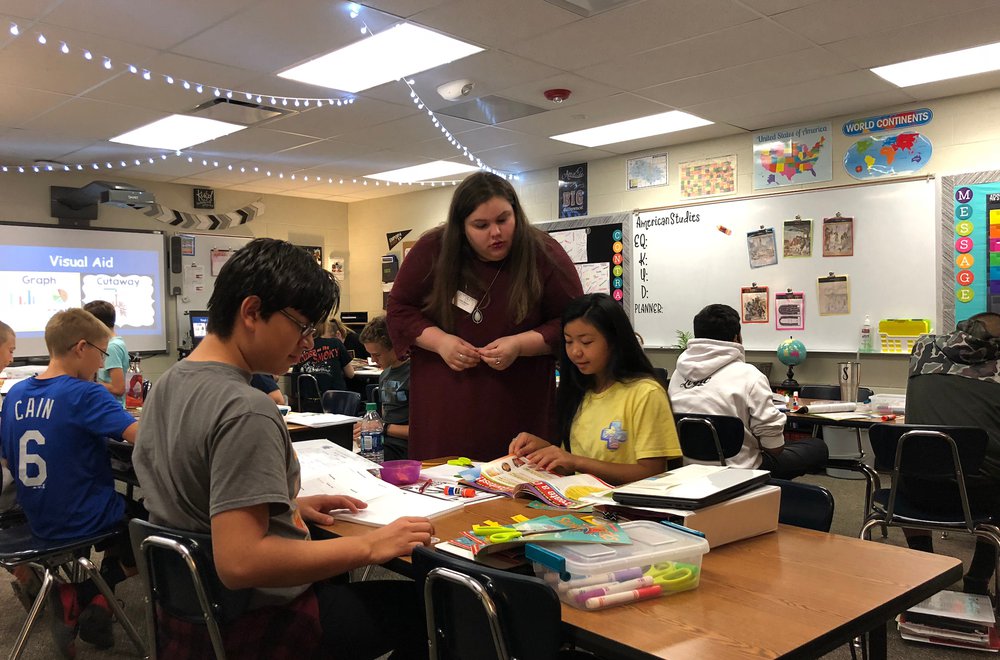 pre-service teacher working with middle school students