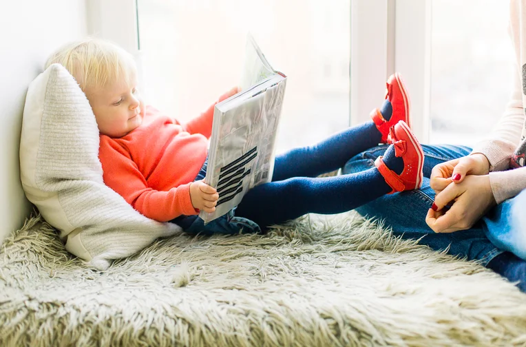 Small child reading book