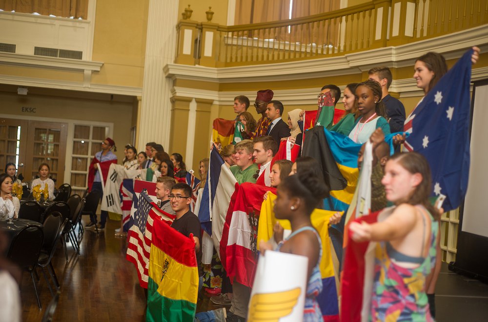 Emporia State University students holding flags of home countries