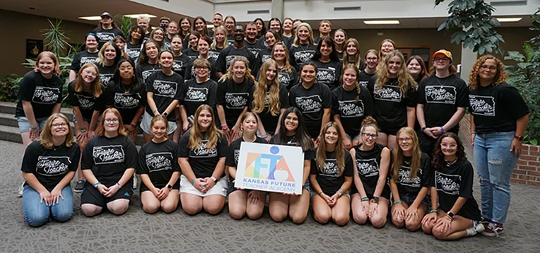 A group of students wear matching T-shirts