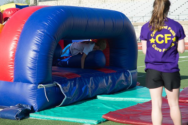 Youth exiting inflatable obstacle course