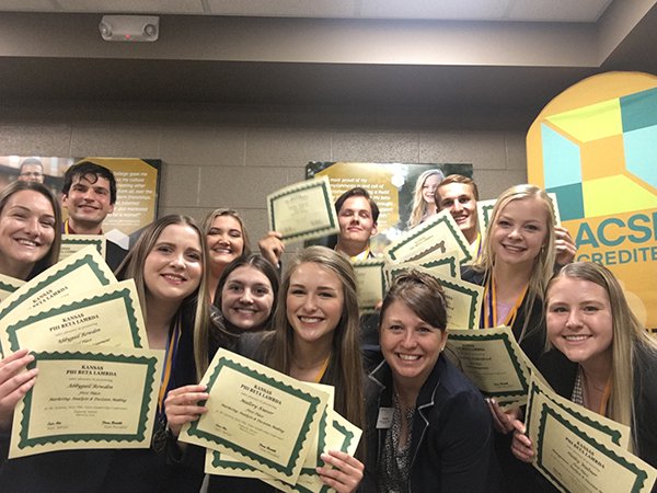 group of Emporia State University School of Business students hold certificates